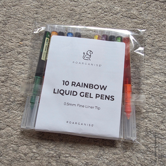 A clear plastic bag containing a set of 10 liquid gel pens with a white paper insert that reads '10 RAINBOW LIQUID GEL PENS' and shows the ROARGANISE brand logo, placed on a gray carpeted floor.